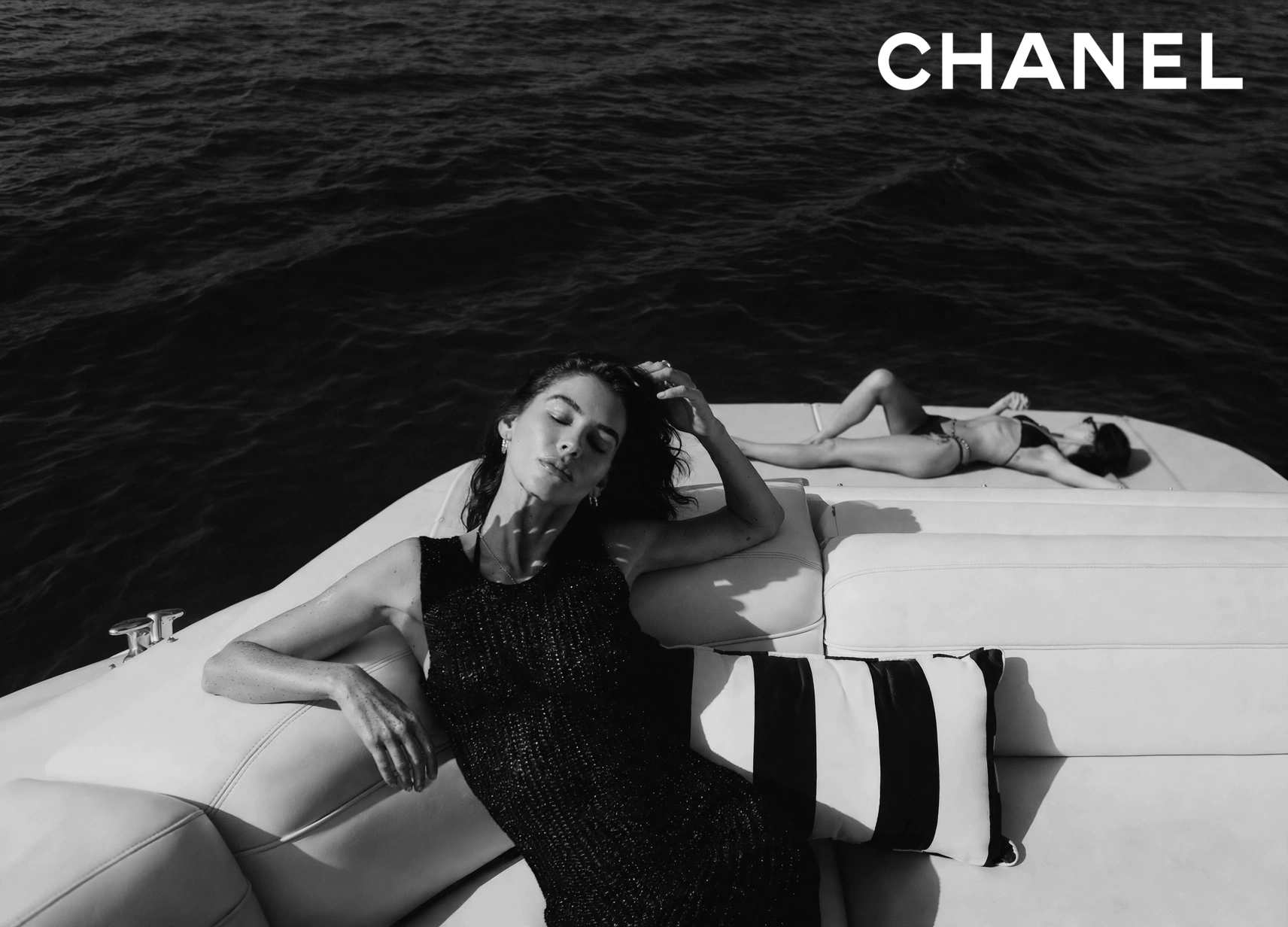 Two women reclining on a yacht